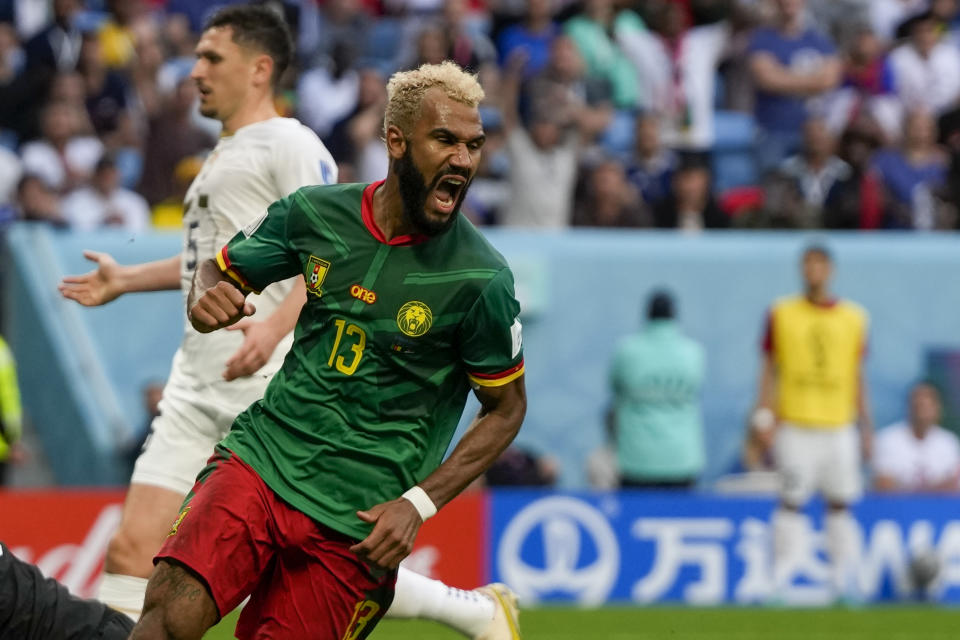 Cameroon's Eric Maxim Choupo-Moting celebrates after scoring his side's third goal during the World Cup group G soccer match between Cameroon and Serbia, at the Al Janoub Stadium in Al Wakrah, Qatar, Monday, Nov. 28, 2022. (AP Photo/Frank Augstein)