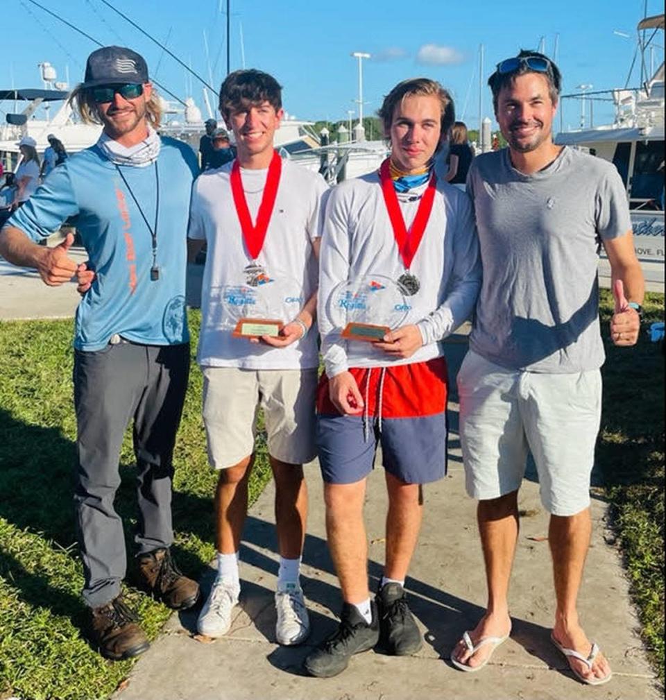 From left, Ian Robinson (Coral Reef Yacht Club&#x002019;s Club 420 coach), Westminster Christian senior Enzo Menditto, MAST Academy sophomore Julien Waite, and Romain Bonnaud (Coral Reef Yacht Club&#x002019;s Club 420 coach) at the Orange Bowl International Youth Regatta.