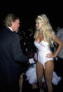 <p>Donald Trump talks with a Playboy Bunny during the Betsey Johnson Spring 2001 Fashion Show at Bryant Park in New York City on Sept. 19, 2000. (Photo: Ron Galella/WireImage/Getty Images) </p>
