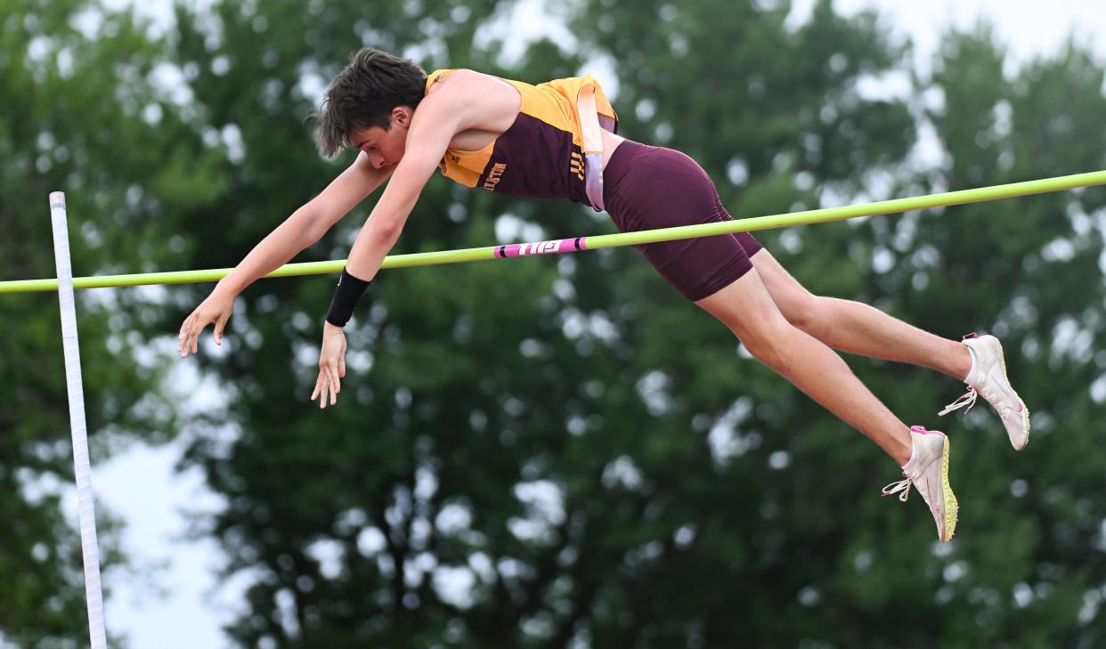 Bloomington North’s Ethan Isles clears 14 feet in the pole vault during the track meet against Bloomington South at North on Wednesday, May 1, 2024.