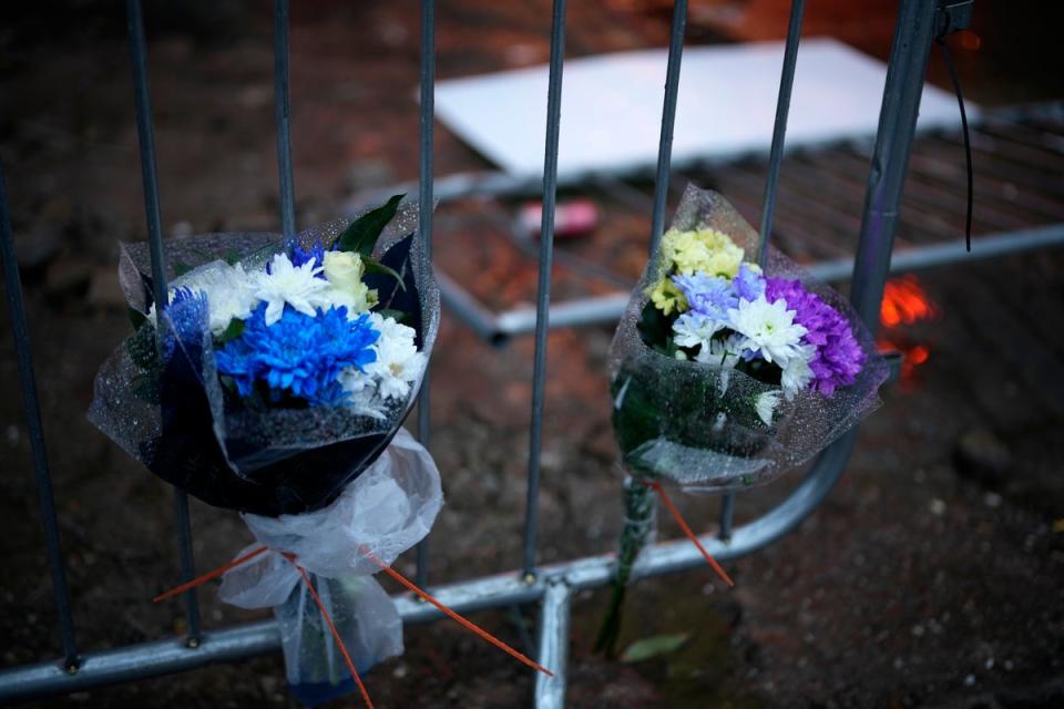 Floral tributes left outside the Crane nightclub, where Mr Fisher died (Getty Images)