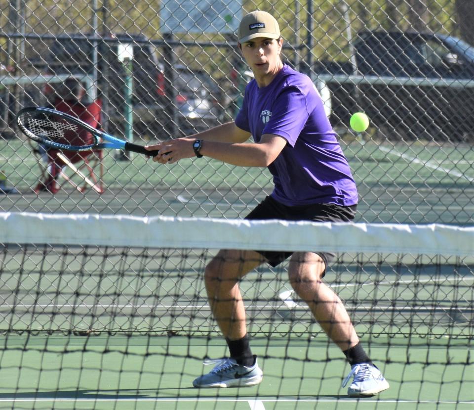 Little Falls Mountie Bobby Russell prepares to return a shot Thursday during a match against Westmoreland.