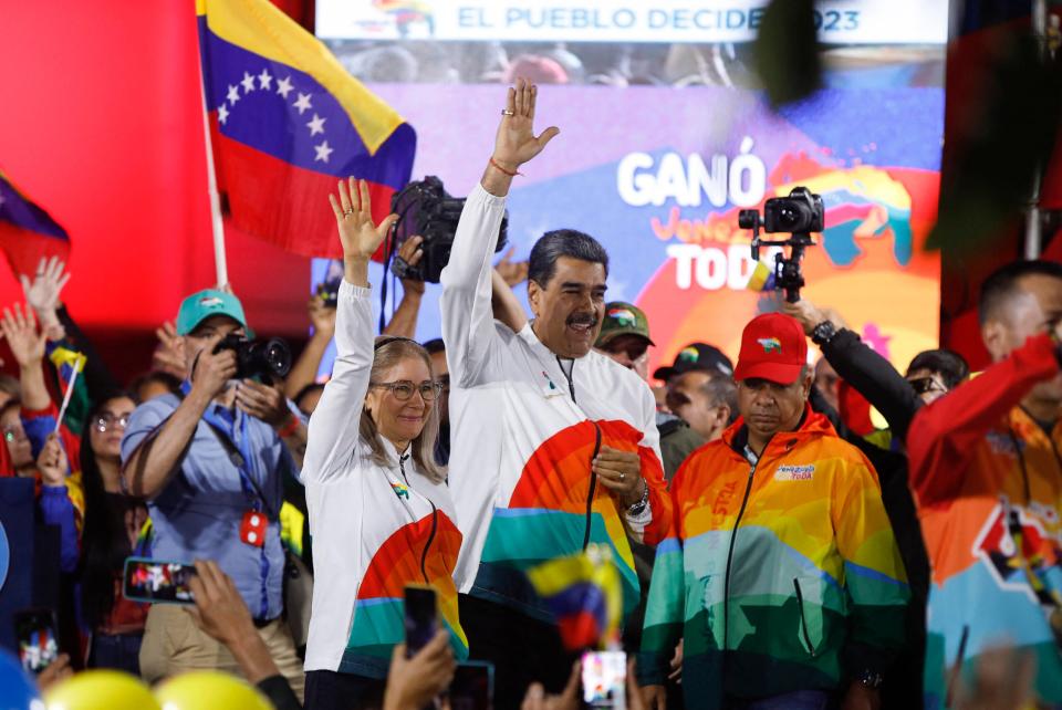 President of Venezuela, Nicolás Maduro, greets supporters before giving a speech as the National Electoral Council issued the results of the consultative referendum on Venezuelan sovereignty over the Essequibo, in Caracas on December 3, 2023. <em>Photo by PEDRO RANCES MATTEY/AFP via Getty Images</em>