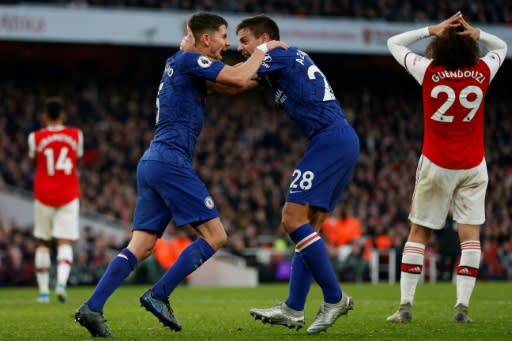 Jorginho (left) celebrates after equalising for Chelsea against Arsenal