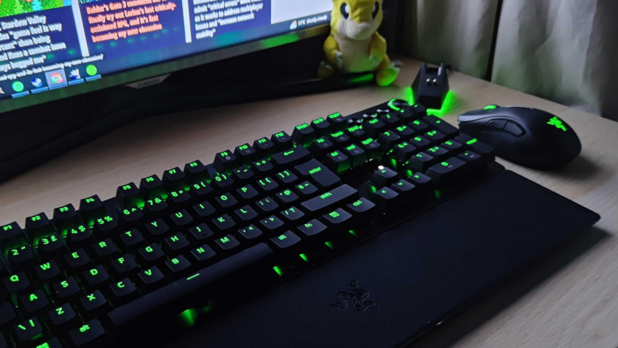  Razer Hunstman V3 Pro on a desk beside a mouse, monitor, Sandshrew plushie, and mouse dock. 