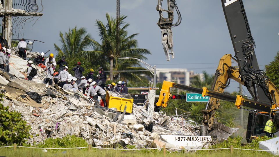 Workers search the rubble at the Champlain Towers South Condo, Monday, June 28, 2021, in Surfside, Fla. Many people were still unaccounted for after Thursday's fatal collapse. (AP Photo/Lynne Sladky)