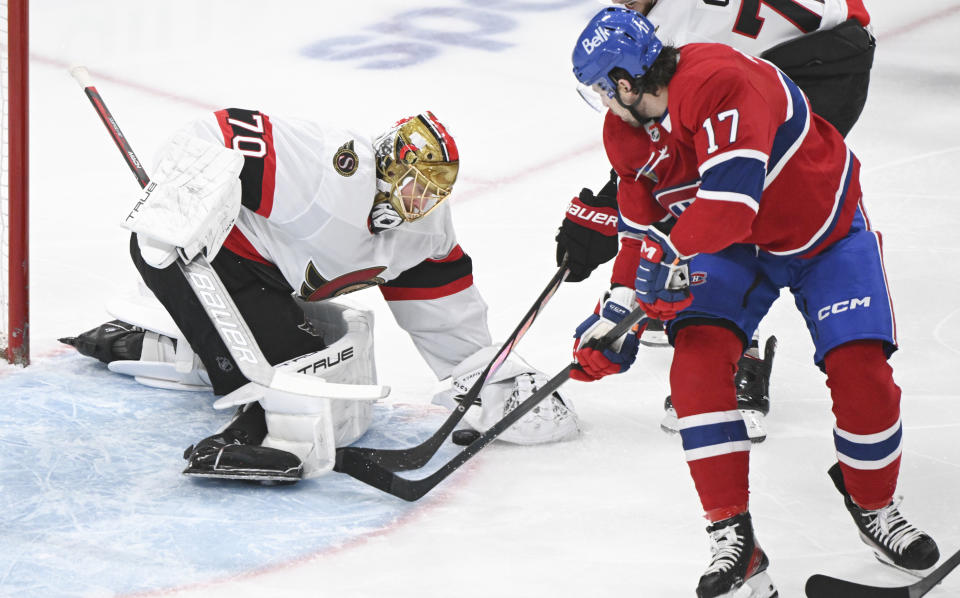Montreal Canadiens' Josh Anderson (17) is stopped by Ottawa Senators goaltender Joonas Korpisalo during the first period of an NHL hockey game in Montreal, Tuesday, Jan. 23, 2024. (Graham Hughes/The Canadian Press via AP)