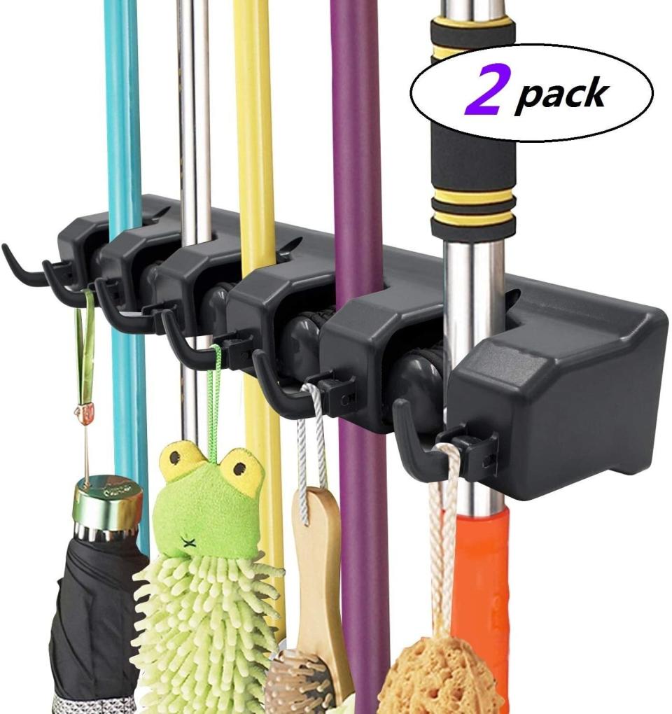Get those brooms, mops, rakes and other cleaning tools off your floors, out of the closets and neatly organized once and for all with <a href="https://amzn.to/3nQoKLd" target="_blank" rel="noopener noreferrer">this organizer</a>. It's a two-pack that includes five slots for storing handles and six hooks &mdash; you can store one in the kitchen and another in the garage. You won't believe how you've gone this long without it. Normally $18, <a href="https://amzn.to/3nQoKLd" target="_blank" rel="noopener noreferrer">get it on sale for $13</a> on Prime Day on Amazon.
