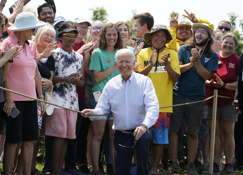 President Joe Biden poses for a photo after touring King Orchards fruit farm Saturday, July 3, 2021, in Central Lake, Mich. (AP Photo/Alex Brandon)