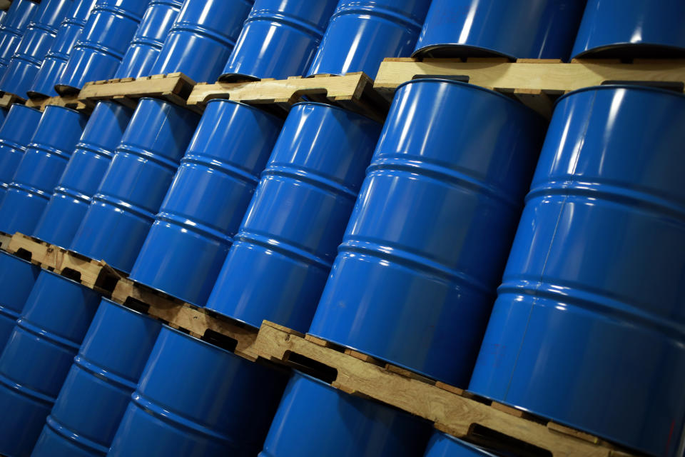 Blue oil drums stacked in a warehouse in Indiana, U.S. Photographer: Luke Sharrett/Bloomberg