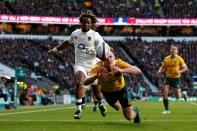 Australia's Dane Haylett-Petty (front) touches down behind the line under pressure from England's Marland Yarde during a Test match at Twickenham in south-west London, on December 3, 2016