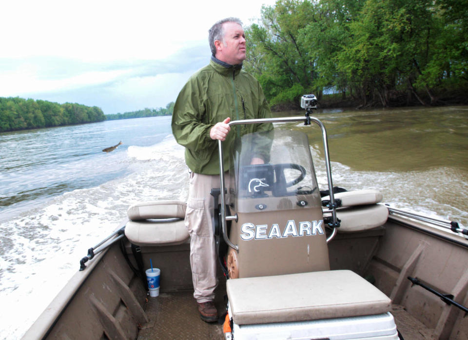 Brendan Kearns causes a silver carp to jump out of the Wabash River by driving his boat slowly along the shore and playing loud music, and stomping. The invasive species are wreaking havoc on waterways, and officials are giving them a new name so they are more palatable to the public. They hope to create a market so increased fishing of Asian carp will help reduce and control the population.