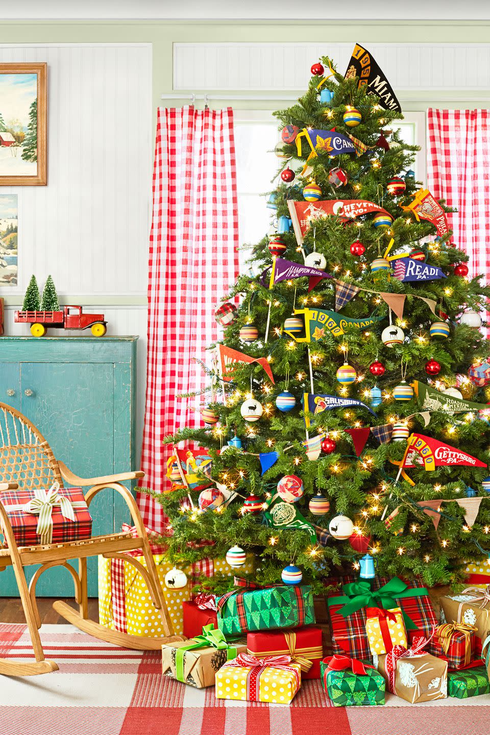 <p>The Christmas tree in this <a href="https://www.countryliving.com/home-design/house-tours/g3857/christmas-camp-decorating-ideas/" rel="nofollow noopener" target="_blank" data-ylk="slk:camp-style California cabin;elm:context_link;itc:0;sec:content-canvas" class="link ">camp-style California cabin</a> is peppered with <span class="redactor-unlink">pennants from National Parks</span> and roadside attractions.</p><p><a class="link " href="https://go.redirectingat.com?id=74968X1596630&url=https%3A%2F%2Fwww.etsy.com%2Fsearch%2Fvintage%3Fq%3Dpennants%26use_mmx%3D1%26vintage_rewrite%3Dvintage%2Bpennants%26original_query%3D2&sref=https%3A%2F%2Fwww.countryliving.com%2Fhome-design%2Fdecorating-ideas%2Ftips%2Fg1251%2Ftrim-christmas-trees-1208%2F" rel="nofollow noopener" target="_blank" data-ylk="slk:SHOP VINTAGE PENNANTS;elm:context_link;itc:0;sec:content-canvas">SHOP VINTAGE PENNANTS</a><br></p>