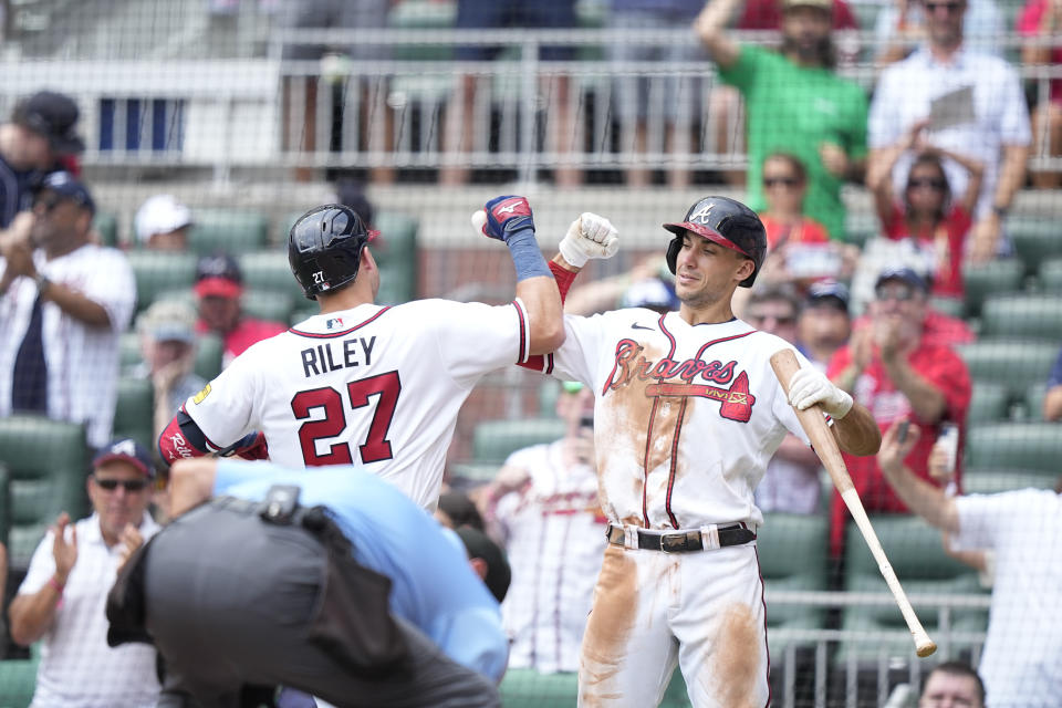 Atlanta Braves' Austin Riley, left, celebrates with Matt Olson, right, after Riley hit a two run home run in the fourth inning of a baseball game against the Los Angeles Angels, Wednesday, Aug. 2, 2023, in Atlanta. (AP Photo/Brynn Anderson)