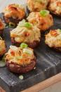 <p>Everyone loves a good <a href="https://www.delish.com/uk/cooking/recipes/a29707397/easy-stuffed-mushroom-recipe/" rel="nofollow noopener" target="_blank" data-ylk="slk:stuffed mushroom;elm:context_link;itc:0;sec:content-canvas" class="link ">stuffed mushroom</a>. In fact, we'd venture to say it's one of the world's best party snacks. They're easy to make and reheat, perfectly bite-sized, and ridiculously delicious. This version is even MORE irresistible with the addition of sweet, tender crab, fresh spring onions, and rich cream cheese.</p><p>Get the <a href="http://www.delish.com/uk/cooking/recipes/a32978049/crab-artichoke-stuffed-mushrooms-recipe/" rel="nofollow noopener" target="_blank" data-ylk="slk:Crab Stuffed Mushrooms;elm:context_link;itc:0;sec:content-canvas" class="link ">Crab Stuffed Mushrooms</a> recipe.</p>