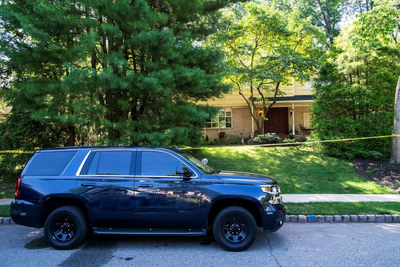 Law enforcement officials are seen outside the home of federal judge Esther Salas in North Brunswick, New Jersey