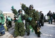 Saskatchewan Roughriders fans arrive in costume for the CFL's 101st Grey Cup championship football game in Regina, Saskatchewan November 24, 2013. REUTERS/Mark Blinch (CANADA - Tags: SPORT FOOTBALL)