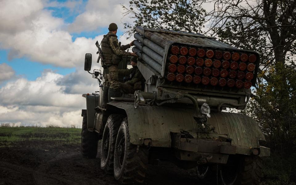 A multiple rocket launcher crew move down a road along the front line in Donetsk region - ANATOLII STEPANOV/AFP