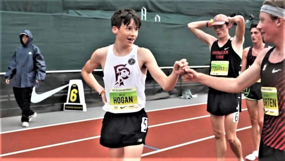 Hastings resident Myles Hogan of Fordham Prep (l) accepts congratulations from Colorado's Jackson Shorten (r) after winning the Nike Outdoor Nationals champion two-mile run June 18, 2022 at Hayward Field in Eugene, Oregon.