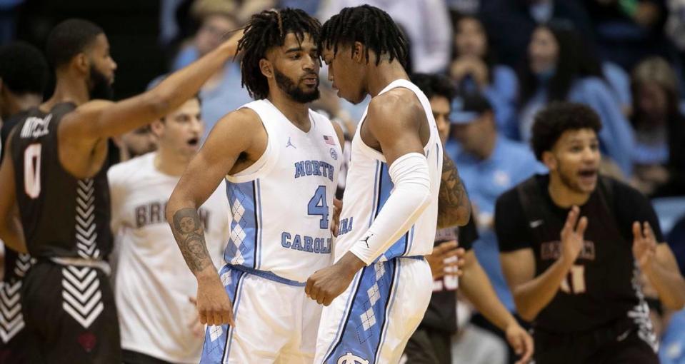 North Carolina’s Caleb Love (2) chest bumps R.J. Davis (4) after a three point basket by Davis during the second half against Brown on Friday, November 12, 2021 at the Smith Center in Chapel Hill, N.C. Robert Willett/rwillett@newsobserver.com