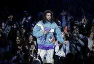 Rapper J. Cole performs at halftime during NBA All-Star basketball game, Sunday, Feb. 17, 2019, in Charlotte, N.C. (AP Photo/Gerry Broome)