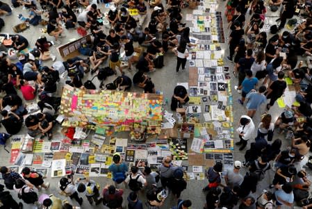 Anti-extradition bill demonstrators attend a protest at the arrival hall of Hong Kong Airport