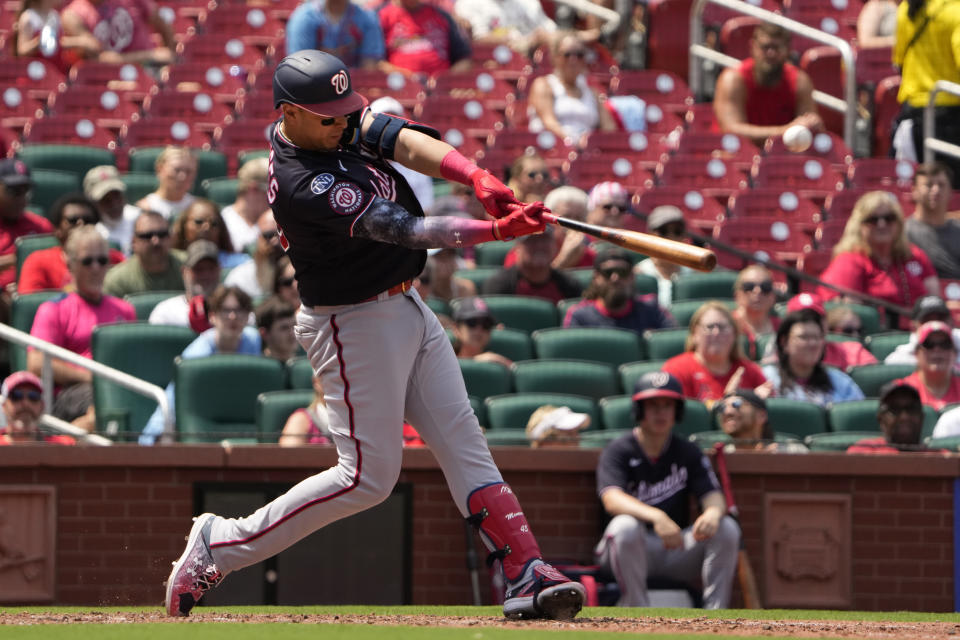 Washington Nationals' Joey Meneses hits an RBI double during the eighth inning in the first game of a baseball doubleheader against the St. Louis Cardinals Saturday, July 15, 2023, in St. Louis. The contest was the resumption of a game started on Friday, but was suspended due to rain. (AP Photo/Jeff Roberson)