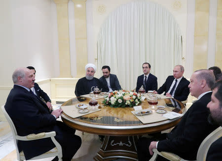 Russian President Vladimir Putin, Iranian President Hassan Rouhani, Turkish President Recep Tayyip Erdogan and President of Belarus Alexander Lukashenko attend an informal meeting in the Black sea resort of Sochi, Russia, February 14, 2019. Sputnik/Mikhael Klimentyev/Kremlin via REUTERS