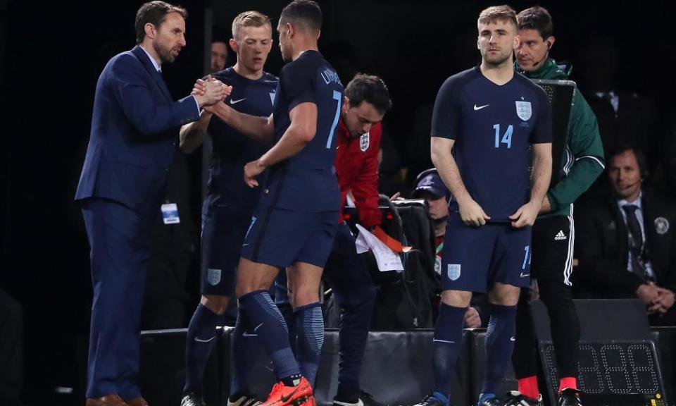 The England manager, Gareth Southgate, congratulates Jake Livermore as he is substituted for James Ward-Prowse during the international friendly against Germany.