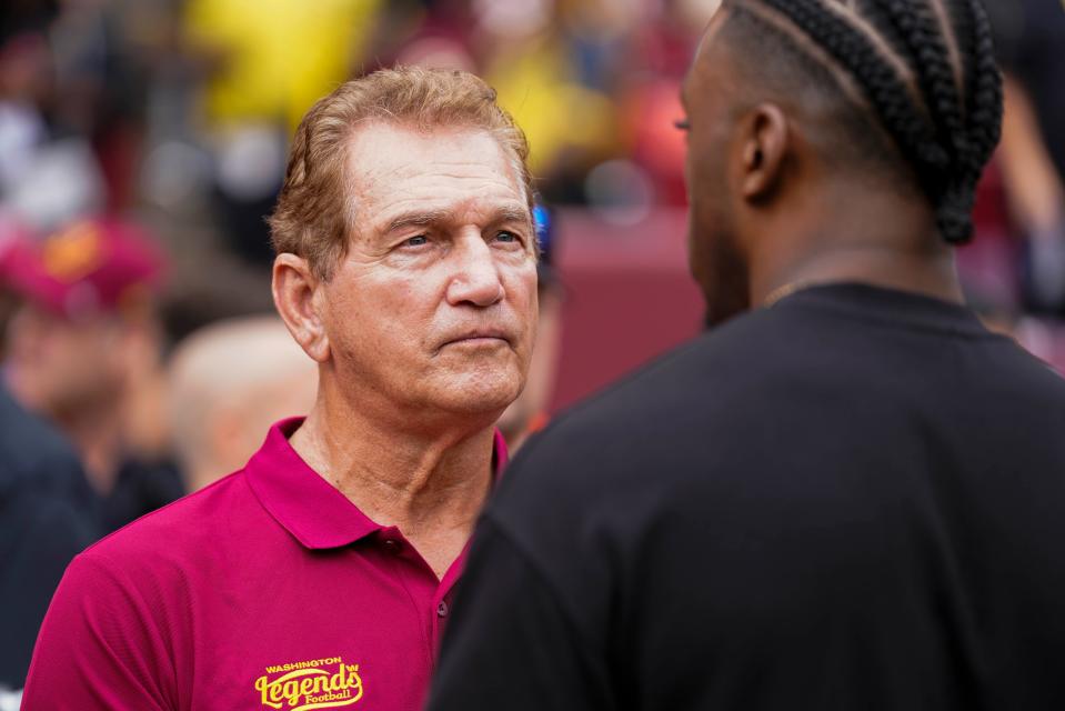 Former professional football player Joe Theismann (left) speaks with Robert Griffin III before the Washington Commanders and Arizona Cardinals game at FedExField on Sept. 10, 2023, in Landover, Maryland.