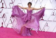 <p>The year's Academy Awards presenter Halle Berry wore a flowy mauve strapless gown by Dolce & Gabbana—topped with an unforgettable fake bob cut. </p>