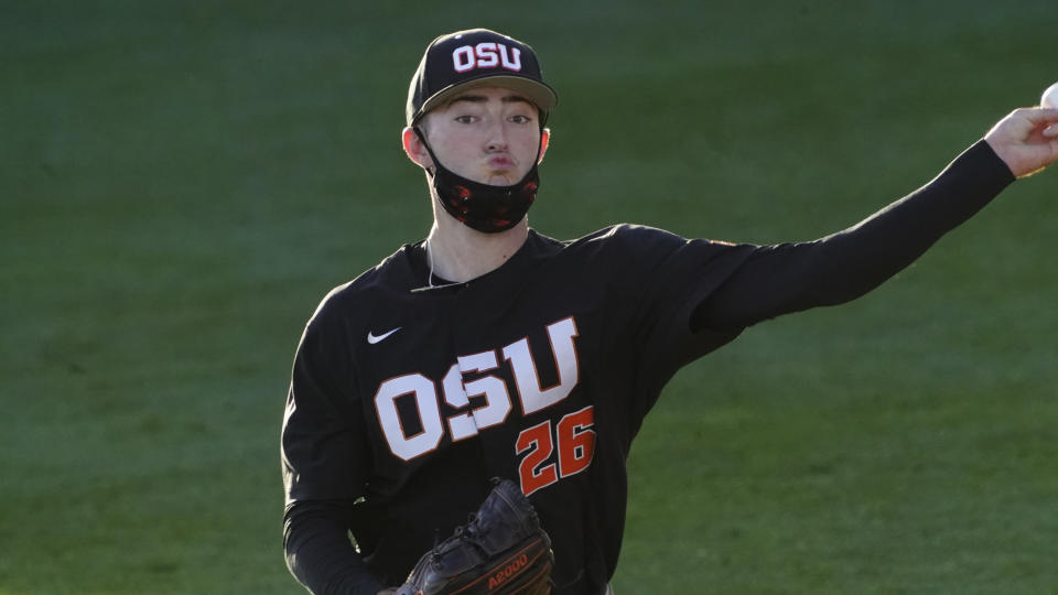 FILE - Oregon State's Cooper Hjerpe (26) throws during an NCAA baseball game against Oregon State on Friday, Feb. 26, 2021, in Phoenix. Hjerpe is expected to compete in the inaugural Pac-12 NCAA college baseball tournament this week in Scottsdale, Ariz. (AP Photo/Rick Scuteri, File)