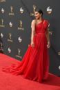 <p>People just love matching the red carpet! Priyanka wore this A-line gown with an over-the-top train to attend the ceremony and kept her hair back in a sleek ponytail. </p>