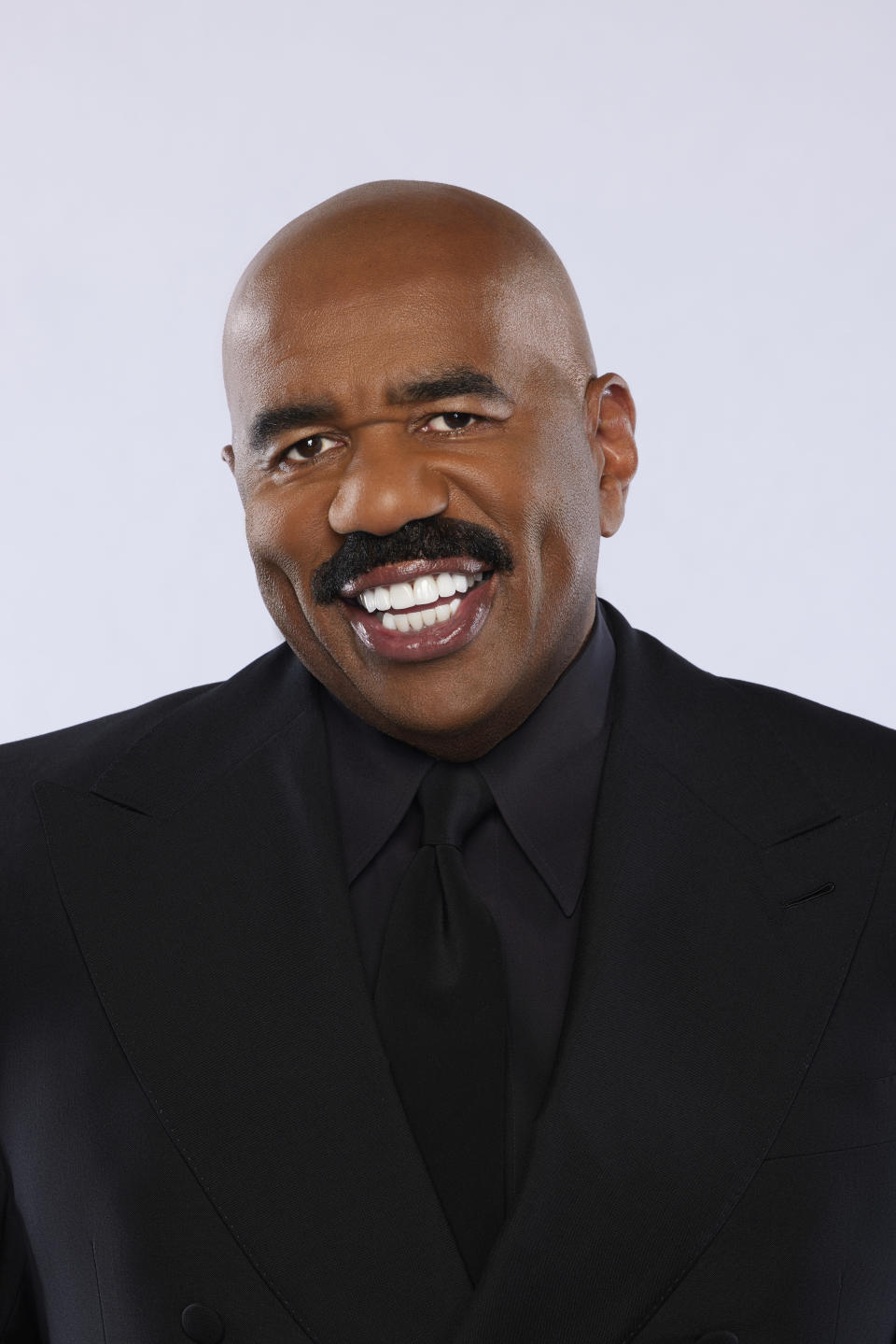 Steve Harvey smiles in a promotional photo for "Judge Steve Harvey"