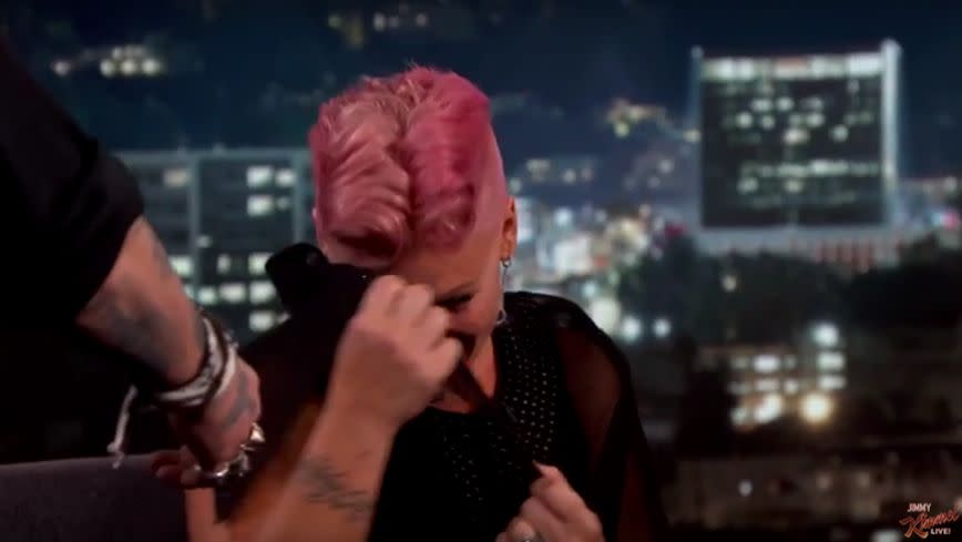Poor Pink went the colour of her hair! Source: YouTube