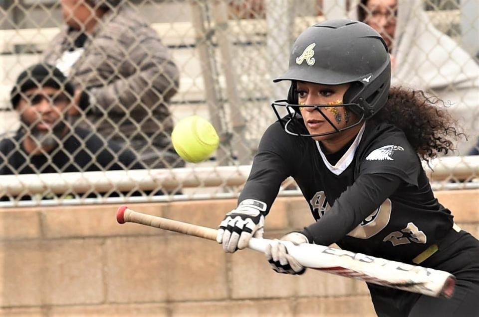 Abilene High's Kayley Washington gets down a bunt to start the game against Cooper. It was popped up to the pitcher for an out. The Lady Eagles beat Cooper 8-1 in the District 4-5A game Tuesday, March 14, 2023, at Cougar Diamond.