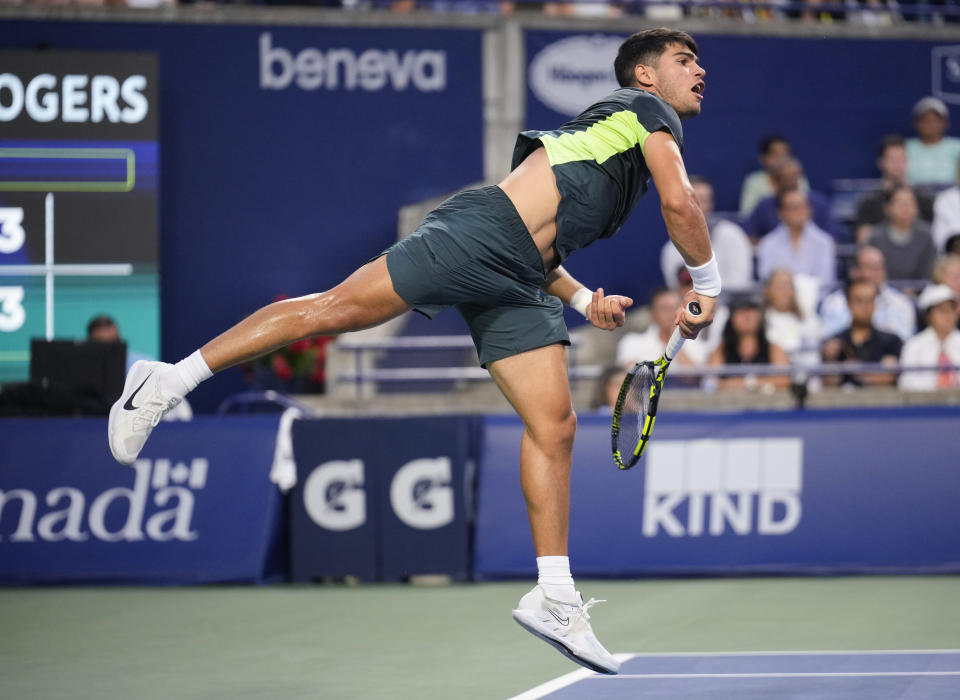 Spain's Carlos Alcaraz follows through on a serve to Poland's Hubert Hurkacz during the National Bank Open men’s tennis tournament Thursday, Aug. 10, 2023, in Toronto. (Mark Blinch/The Canadian Press via AP)