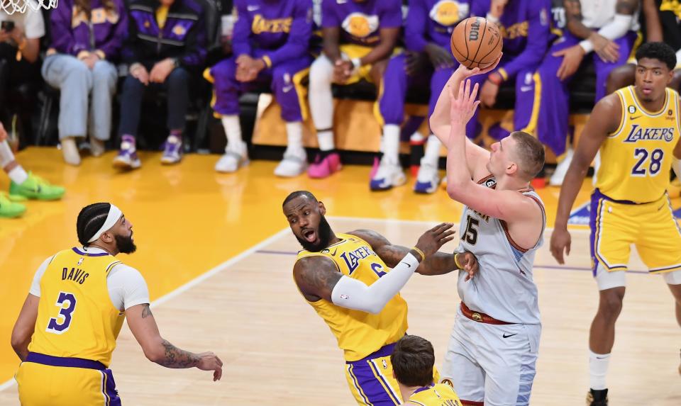 Nikola Jokic is called for an offensive foul against LeBron James during the Western Conference finals. (Allen Berezovsky/Getty Images)