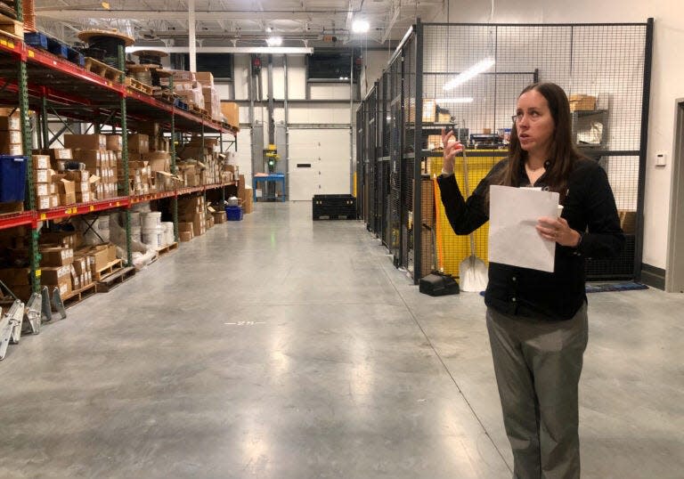 Sara Sankowich, director of sustainability at Unitil, shows off their warehouse space in Exeter.