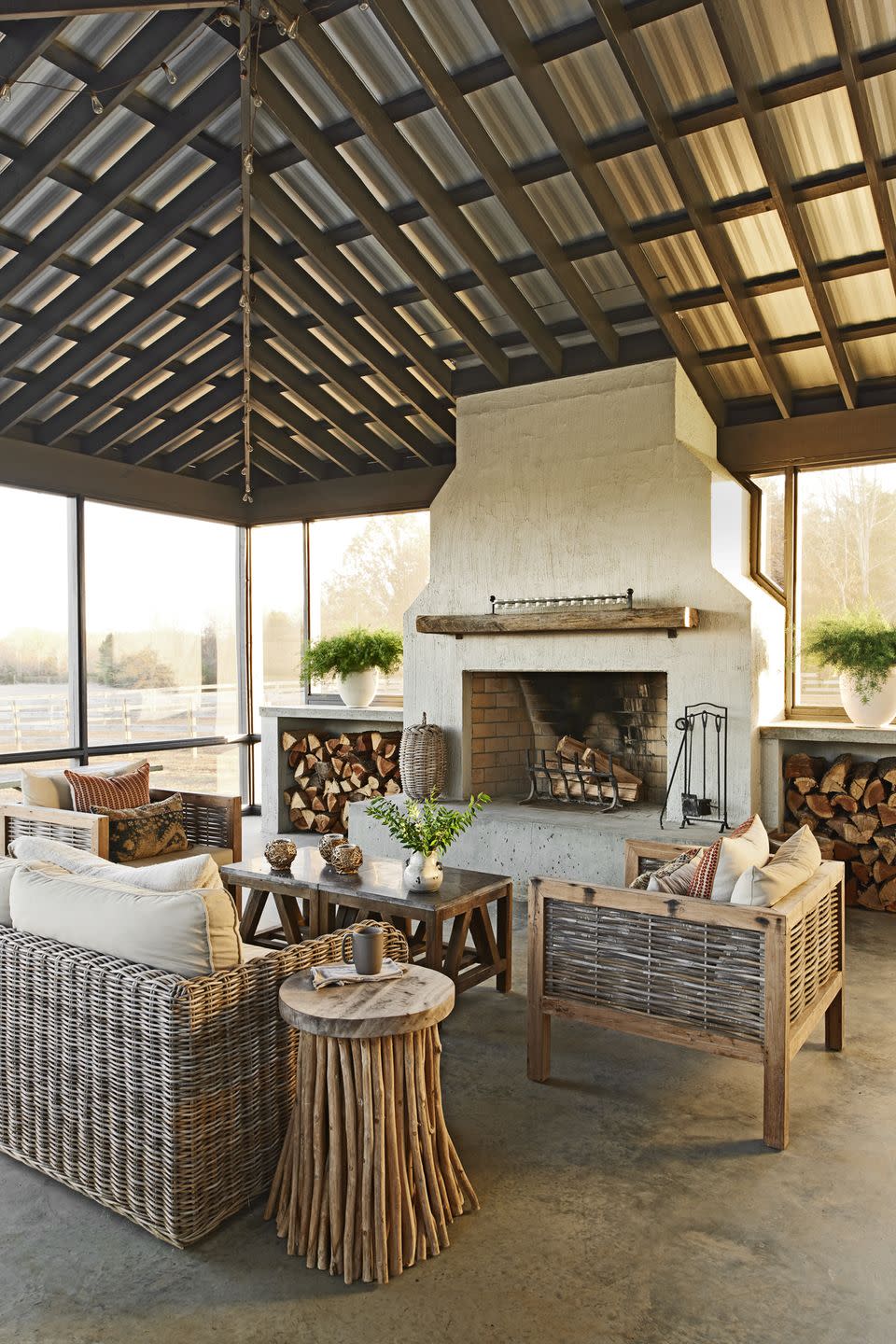 neutral screened porch with stone fireplace