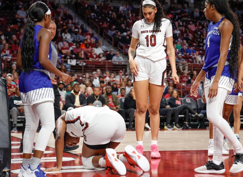 South Carolina’s Aliyah Boston (4) is slow to stand up after being fouled during the first half of action against Hampton in the Colonial Life Arena on Sunday, Nov. 27, 2022.