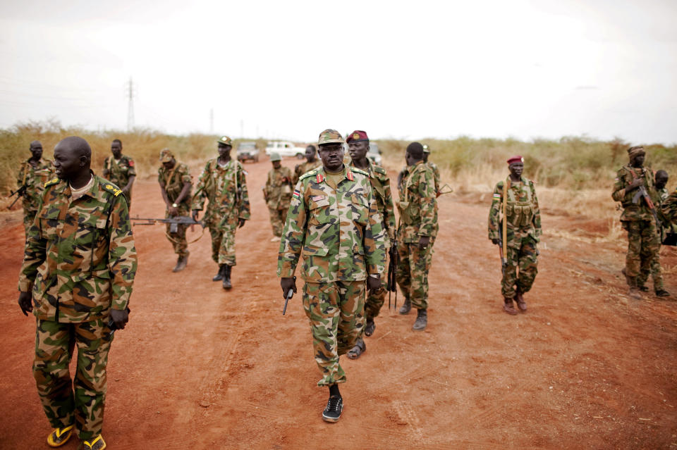 Sudan People's Liberation Army (SPLA) forces at the frontline in Tachuien, Unity State, South Sudan on Friday, May 11, 2012. In late April, tensions between Sudan and South Sudan erupted into armed conflict along their poorly defined border. Thousands of SPLA forces have been deployed to Unity State where the two armies are at a tense stalemate around the state's expansive oil fields. Fighting between the armies lulled in early May after the U.N. Security Council ordered the countries to resume negotiations. South Sudan seceded from the Republic of Sudan in July 2011 following decades of civil war. (AP Photo/Pete Muller)