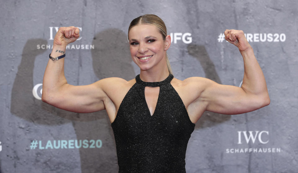 Oksana Masters, Ukrainian-American Paralympic rower and cross-country skier, arrives for the 2020 Laureus World Sports Awards in Berlin, Germany, Monday, Feb. 17, 2020. Masters credits resiliency, determination and being headstrong for what she is today -- an eight-time Paralympic medalist. Masters persevered through 7 1/2 years in Ukrainian orphanages and with birth defects believed to be the aftermath of Chernobyl, the world's worst nuclear accident. That malnourished orphan eventually was adopted by her American mom. She will compete at the Paralympics in Tokyo in road cycling this week. In six months, she also plans to defend her cross-country skiing Paralympic titles in Beijing. (AP Photo/Michael Sohn)