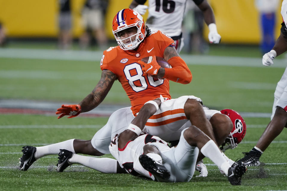 Clemson tight end Braden Galloway is brought down by Georgie defenders during the second half of an NCAA college football game Saturday, Sept. 4, 2021, in Charlotte, N.C. (AP Photo/Chris Carlson)