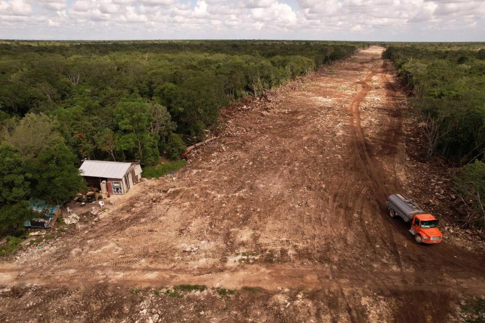 A house stands on the edge of forest which has been cleared for construction of section 5 of the new Mayan Train route, in Solidaridad, Quintana Roo, Mexico on Nov. 6, 2022.<span class="copyright">Jose Luis Gonzalez—Reuters</span>