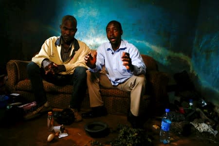 Agbetuya Samuel, a traditional healer and trader explains the uses of Pangolin in traditional medicine to Reuters during an interview at his house in Akure