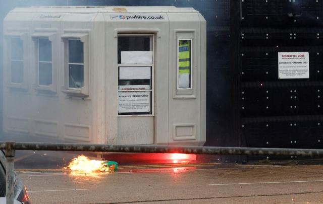 A fire burns next to the Border Force centre after a firebomb attack in Dover