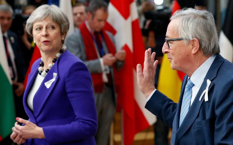 European Commission President Jean-Claude Juncker and Prime Minister Theresa May arrive at a European Union leaders summit in Brussels, Belgium,  - REUTERS