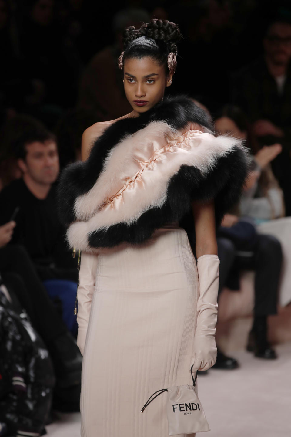 A model wears a creation as part of the Fendi Fall/Winter 2020 collection, presented in Milan, Italy, Thursday, Feb. 20, 2020. (AP Photo/Antonio Calanni)