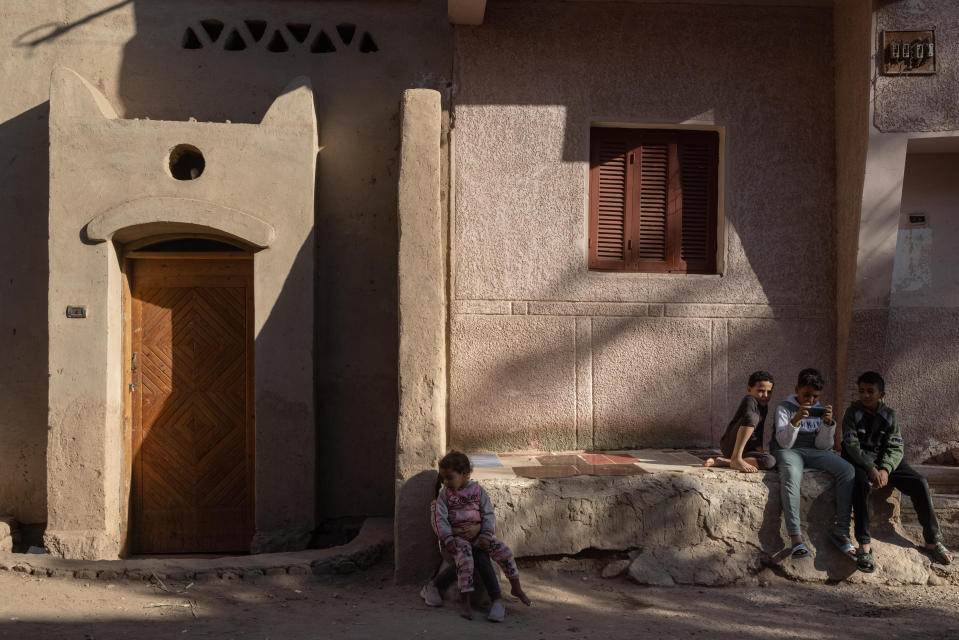 A renovated home designed by Hassan Fathy and owned by Fekri Hassan, side by side with a new home in New Gourna in the suburbs of Luxor, Egypt. (Sima Diab for The Washington Post)